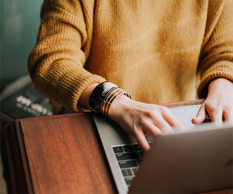 Close up of person using laptop